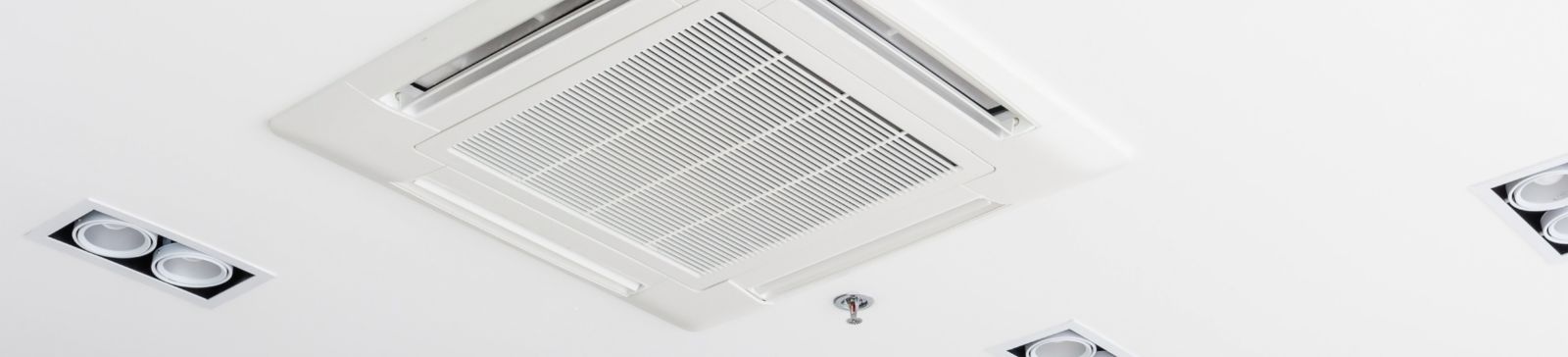 A view at a ceiling mounted cassette type air conditioner